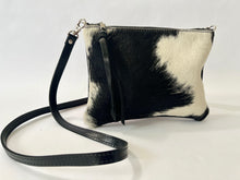 Load image into Gallery viewer, Small cowhide crossbody bag | convertible clutch in black and white hair on hide, handmade in Charlotte NC by Marge and Rudy