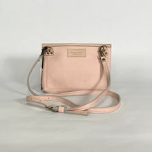 Load image into Gallery viewer, back side of pink leather purse showing makers logo