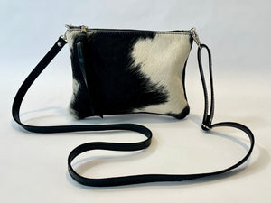 Small cowhide crossbody bag | convertible clutch in black and white hair on hide, handmade in Charlotte NC by Marge and Rudy