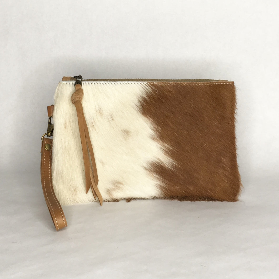 Handmade brown and white cowhide wristlet clutch by Marge and Rudy