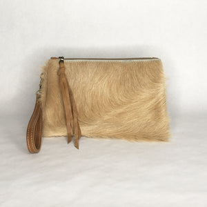 Handmade bohemian cowhide wristlet clutch by Marge and Rudy