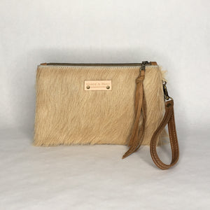 Handmade cowhide wristlet clutch by Marge and Rudy