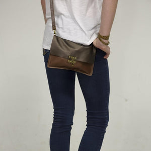 Girl wearing a RRR crossbody bag by Marge & Rudy with jeans and boots